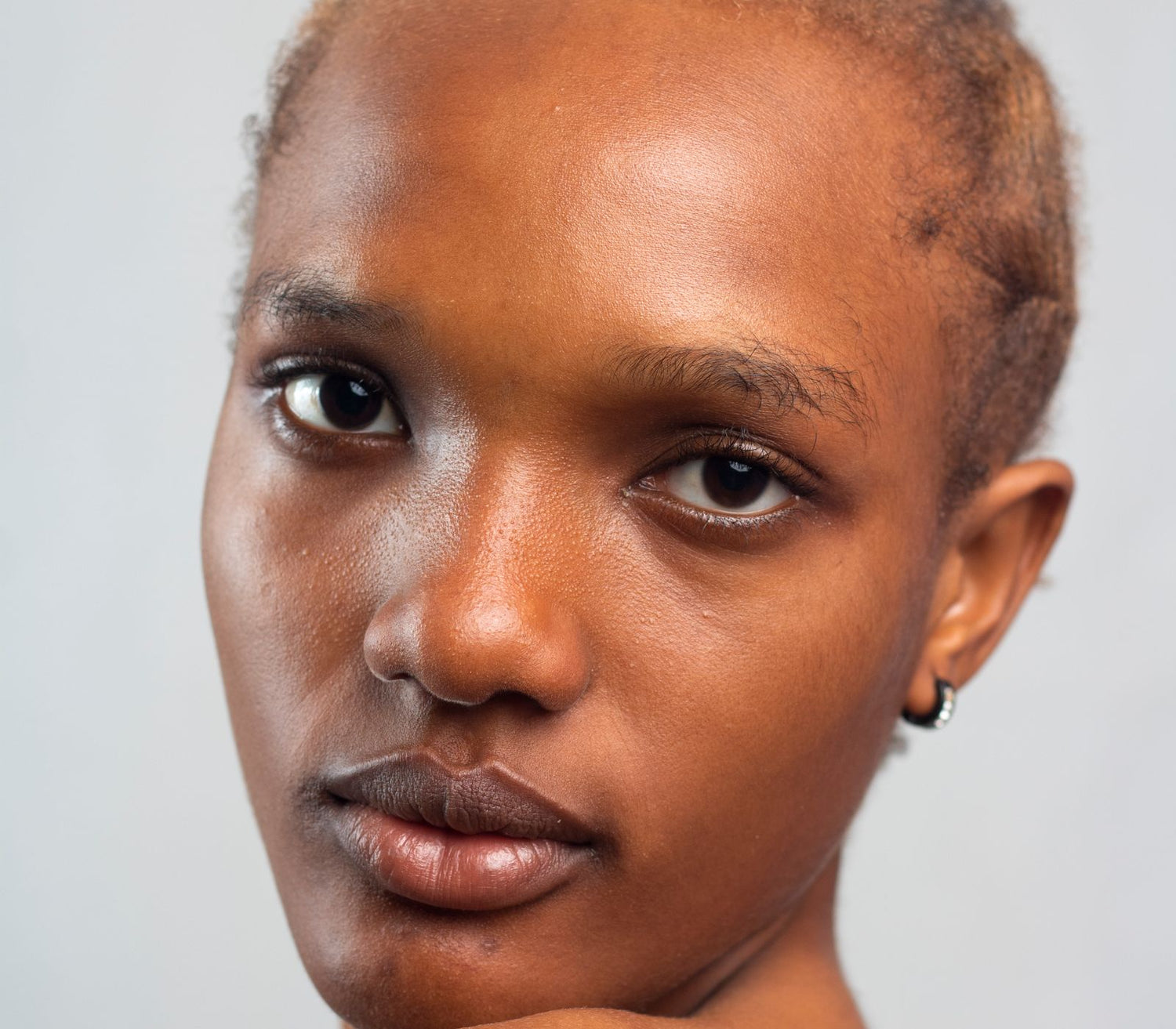 Portrait of a woman with healthy skin in soft daylight