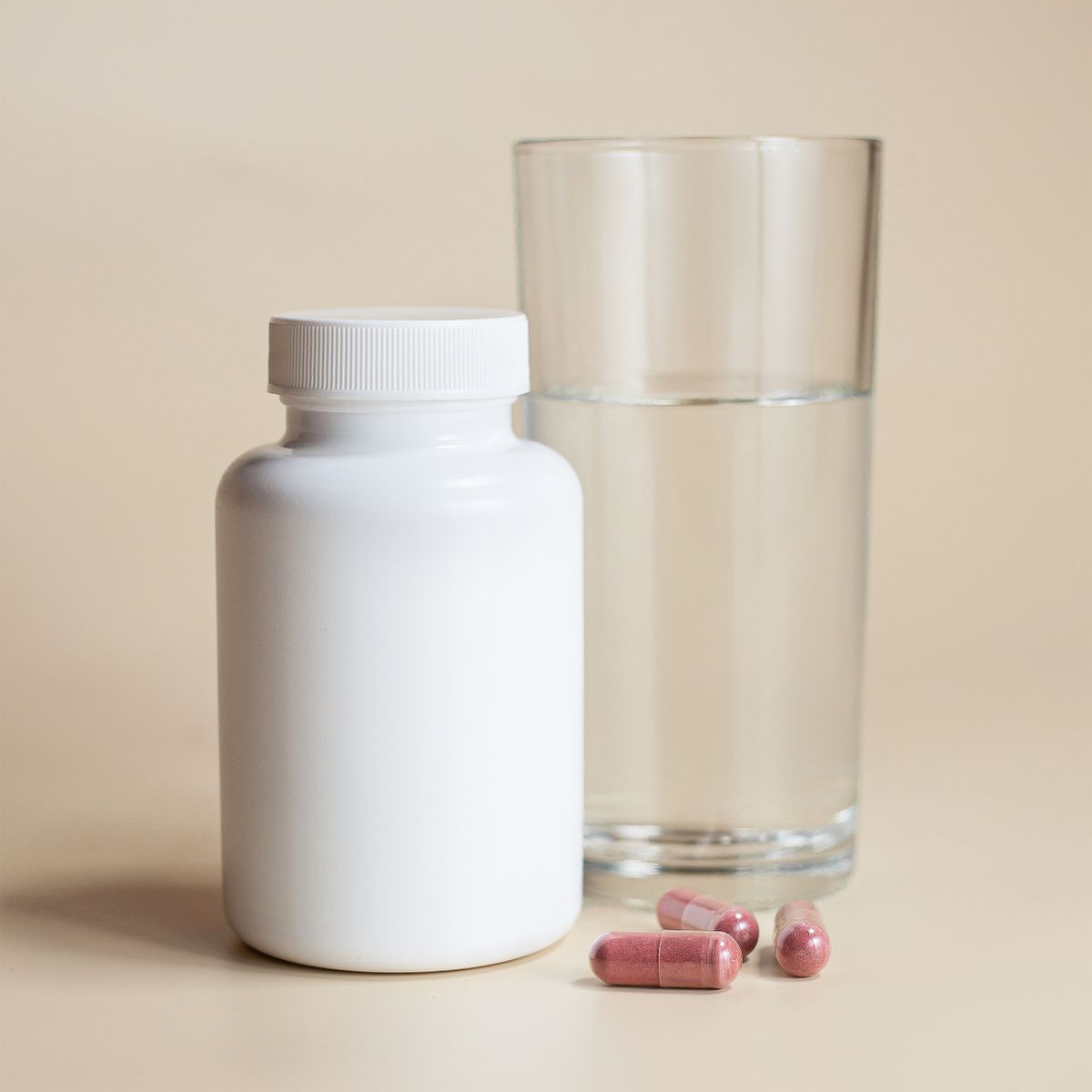 Lorovea Sleep Support Complex bottle beside a glass of water